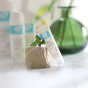 Green People Firming Eye Serum pictured leaning on a small stone pot