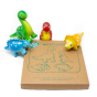 Green Rubber Toys natural rubber mini dinosaur set on a white background next to their recyclable cardboard box packaging