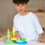 Grimm's Conical Stacking Tower - Neon Green - A child plays with Grimm's Rainbows, Tower toys and Neon friends.