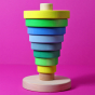 Grimm's Conical Stacking Tower - Neon Green - On a plain pink background. Alternative stacking layout.