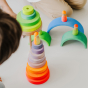 Grimm's Conical Stacking Tower - Neon Pink - Two children play with several sets of Grimm's Rainbows, Tower toys and Neon friends.
