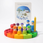Grimm's 12-Piece Rainbow Birthday Celebration Ring with rainbow friends and a candle