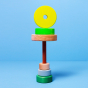 Grimm's Small Conical Stacking Tower - Neon Green - On a plain blue background. Front view of an alternative layout for the puzzle.
