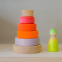 Grimm's Small Conical Stacking Tower - Neon Pink - On a plain beige background. Grimm's Neon Green Friends are at the side of the Tower.
