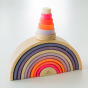 Grimm's Small Conical Stacking Tower - Neon Pink - The Tower sits aloft Grimm's 10 Piece Neon Pink Rainbow on a plain cream background.