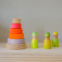 Grimm's Small Conical Stacking Tower - Neon Pink - On a plain beige background. Grimm's Neon Green Friends are at the side of the Tower.