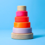 Grimm's Small Conical Stacking Tower - Neon Pink - On a plain blue background.