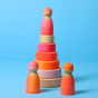 Grimm's Small Conical Stacking Tower - Neon Pink - On a plain blue background. Grimm's Neon Mix Friends are in front and on top of the Tower.
