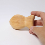 Grimm's Wooden Baby Rattle - Fish in a an adults hand for scale, plain background