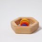 Grimm's Wooden Hexagon Baby Rattle, side view on a grey background