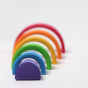 Grimm's Wooden Medium Rainbow with each part forming a tunnel on a grey background