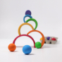 Grimm's Wooden Medium Rainbow stack  with Rainbow Balls on a grey background