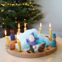 Grimm's 16-Hole Natural Wooden Celebration Ring with beeswax candles in a Christmas display