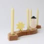 Four Cream 100% beeswax candles in a celebration ring, with a snowman and star decorative figure. White background.