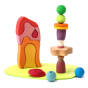 Grimms plastic-free wooden toy blocks set stacked in a tower on a white background