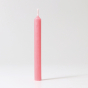 A single Old Rose 10% beeswax candle by Grimm's. White background.