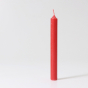 A single Red 10% beeswax candle by Grimm's. White background