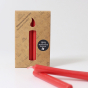 A pack of 12 Red 10% beeswax candles by Grimm's with two red candles out of the cardboard box. White background