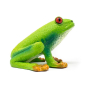 Side view of the Green Rubber Toys bpa free natural rubber tree frog toy sat on a white background
