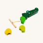 Haba Wooden Crocodile Threading Game. A fun threading game with vibrant green blocks in different shades of green, and a fun smiling crocodile head block attached to a yellow elasticated cord with a wooden stopper with some of he blocks next to the wooden