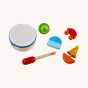 Haba Musical Instruments - Sounds Set. 6 musical instruments include a drum and drum stick, a shaker, a bell chime, a bell rattle and a guiro, on a cream background