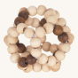 Heimess natural wooden baby teether ball on a beige background