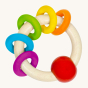 Heimess natural wooden rainbow rings baby teether on a beige background