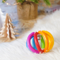 Heimess Touch Ring Elastic Rainbow Ball toy pictured on a fluffy rug

