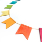 Close up of Hellion Toys eco-friendly handmade wooden rainbow bunting on a white background