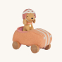 Olli Ella Olli Ella Holdie Dog-go Racer Girl in a pink felt racing car with wooden wheels and white stripes, wearing a pink and white racing hat on a cream back ground