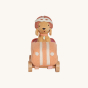 Olli Ella Olli Ella Holdie Dog-go Racer Girl in a pink felt racing car with wooden wheels and white stripes, wearing a pink and white racing hat on a cream back ground