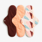 Imse Classic Cloth Pads - night time heavy 3 pack - Orange Sprinkle period pants in plain rust orange, orange, beige, rust, blue and pink and orange with white dots all with white popper snaps on a white background