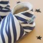 Inch Blue Wild Child cream leather baby shoe with inch blue logo