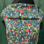 Integra Size 2 Gnomes Regular Strap Baby Carrier against a green wooden background.