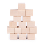 Just blocks handmade wooden toy stacking cubes piled in a geometric tower on a white background