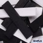 Close up of the black and white Kapla wooden construction kit pieces