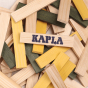 Close up of a pile of Kapla Waldorf stacking blocks in the natural, yellow and green colours