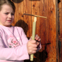 Child demonstrating how to use the Kraul Super Bamboo Dragonfly.