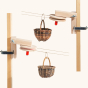 The Kraul Basket Cable Car Kit string, two small wicker baskets, two metal cramps, and two wheel stations to assemble