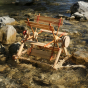 Kraul Wooden River Wheel Kit standing in a river