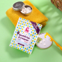Lamazuna Ginger & Lemon Toothpaste Tablets pictured with storage tin with tablets in on a yellow towel
