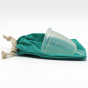 Picture of the Lamazuna menstrual cup on top of its teal storage pouch.