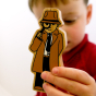A child plays with the Lanka Kade Brown Detective.