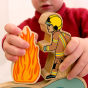 A child plays with the Lanka Kade Brown Running Firefighter in a home environment.