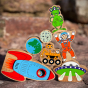 Close up of the Lanka Kade plastic-free wooden space toys in a stack on a rock