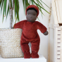 large poppy coloured waldorf doll with black skin