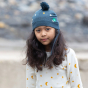 A child wears the LGR Golden Stars Knitted Hat in an outdoor setting.