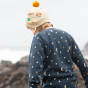 A child wears the LGR Flower Knitted Hat in an outdoor setting.