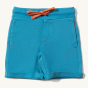 Little Green Radicals Blue Marl Comfy Jogger Shorts. Made from GOTS organic cotton, they comfy blue shorts have two pockets and an orange drawstring cord in the waistband