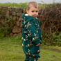 A young child wears the LGR Around The Campfire Sherpa Fleece Snowsuit in an outdoor setting.